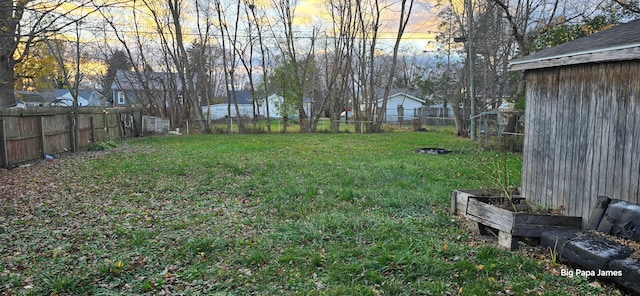 view of yard at dusk