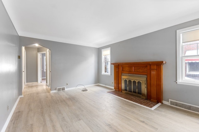 unfurnished living room featuring light hardwood / wood-style floors