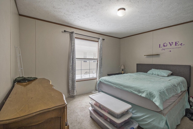 bedroom with ornamental molding, light carpet, and a textured ceiling