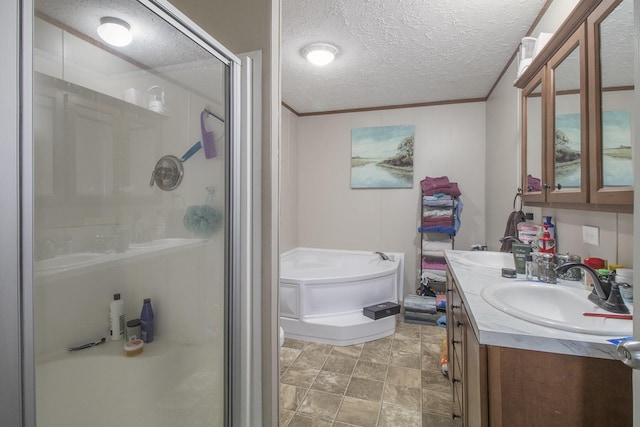 bathroom with vanity, crown molding, plus walk in shower, and a textured ceiling