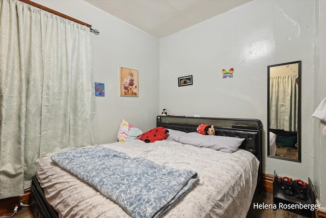 bedroom with wood-type flooring