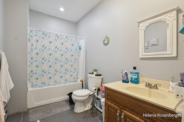 full bathroom with shower / tub combo with curtain, vanity, and toilet