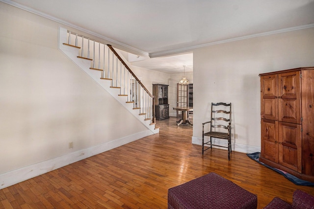 foyer featuring hardwood / wood-style flooring and ornamental molding