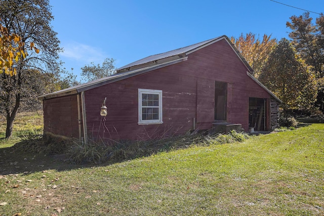 view of property exterior featuring a lawn