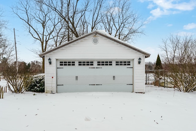 view of snow covered garage