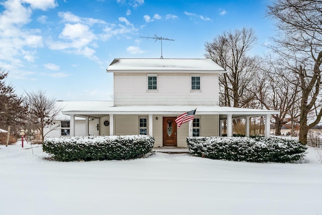 country-style home featuring a porch