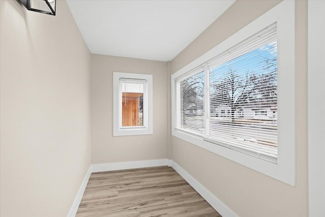 spare room featuring light hardwood / wood-style floors