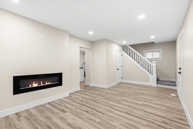 unfurnished living room featuring light hardwood / wood-style floors