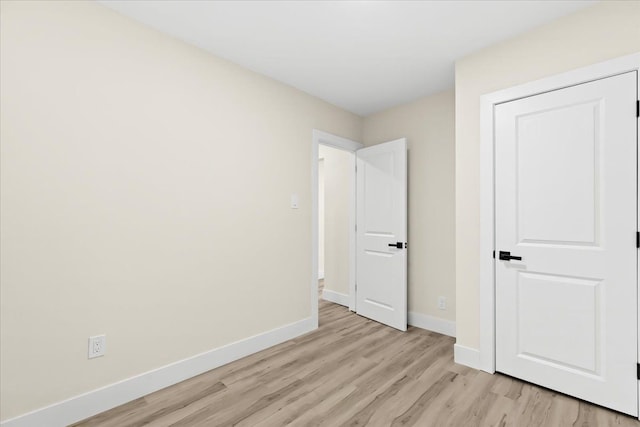 unfurnished bedroom featuring light hardwood / wood-style floors