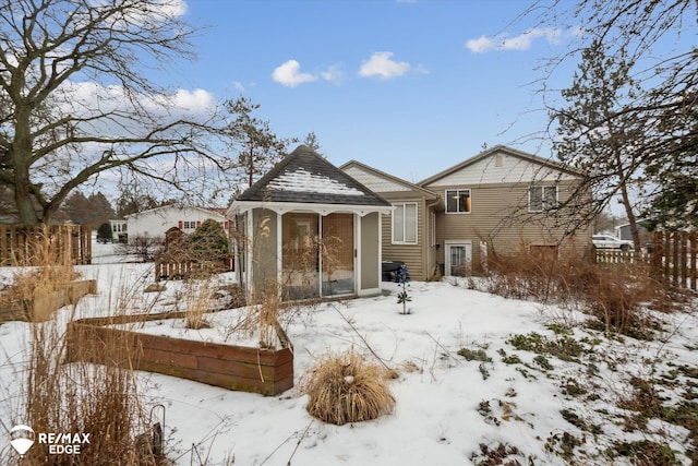 view of snow covered house