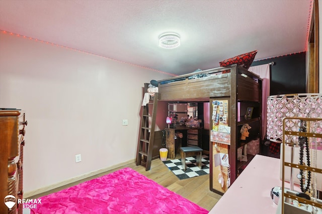 bedroom featuring hardwood / wood-style floors