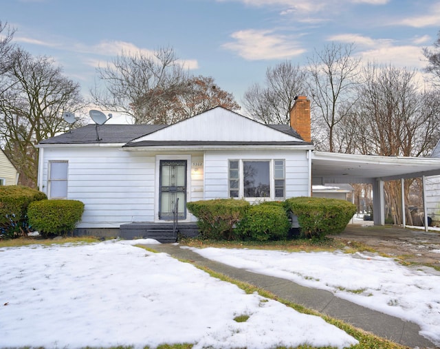 view of front of home featuring a carport