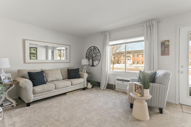 carpeted living room with a wall unit AC