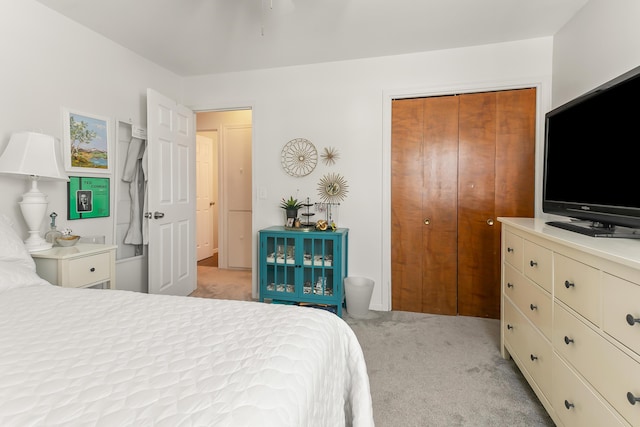 carpeted bedroom with a closet