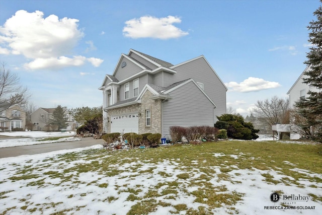 view of snowy exterior featuring a garage