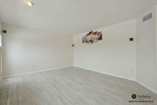 unfurnished room with light hardwood / wood-style flooring