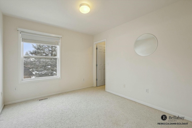 view of carpeted spare room