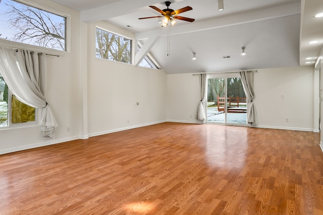 spare room featuring ceiling fan, high vaulted ceiling, beam ceiling, and light hardwood / wood-style floors