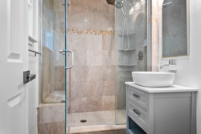 bathroom with vanity and an enclosed shower