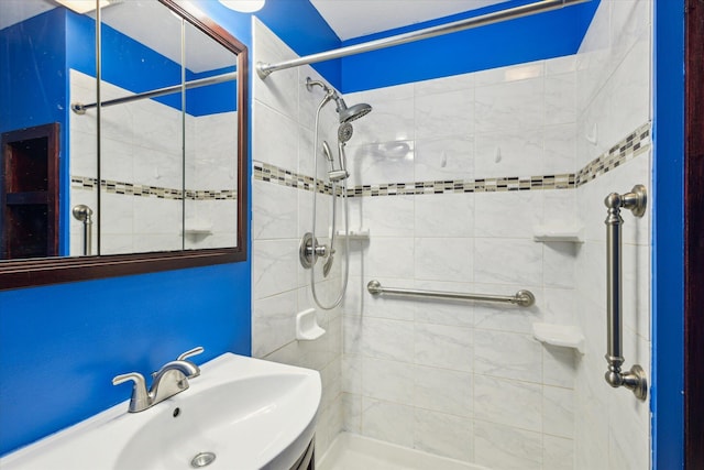 bathroom featuring sink and tiled shower