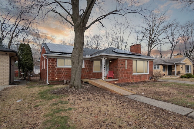 view of front of house featuring solar panels