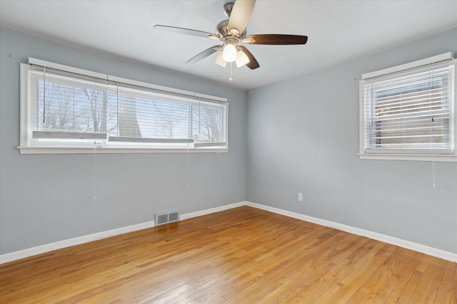 unfurnished room with ceiling fan and light hardwood / wood-style flooring