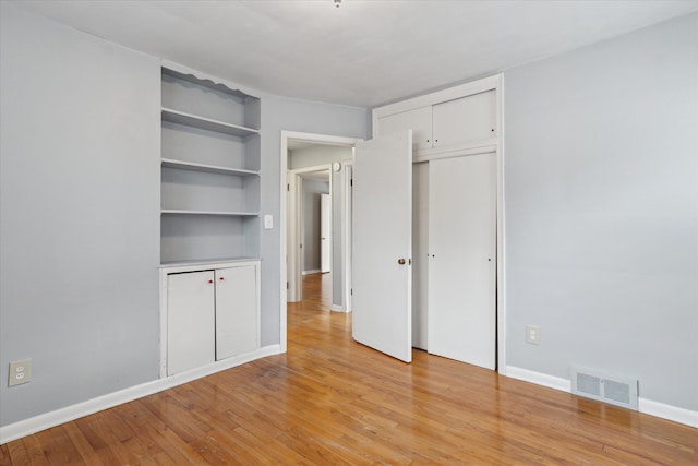 unfurnished bedroom featuring light hardwood / wood-style floors