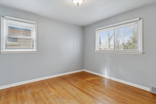 empty room with light hardwood / wood-style floors