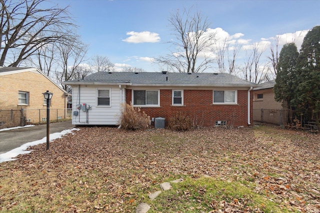 back of property featuring central AC unit