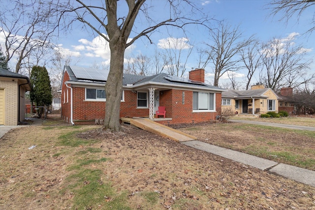 view of front of property with solar panels