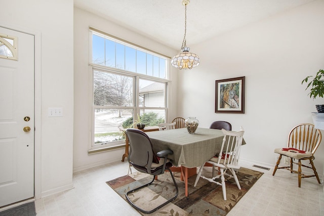 dining room featuring a notable chandelier