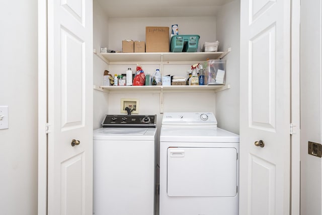 washroom with washer and dryer