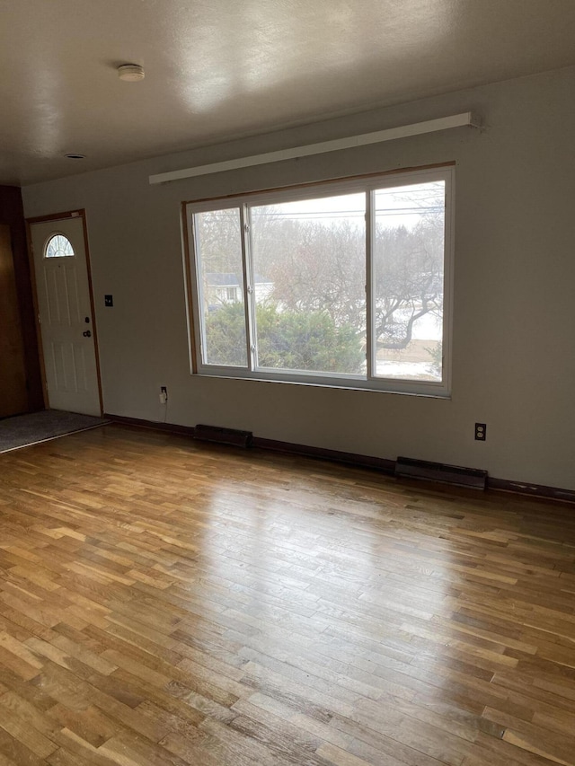 foyer entrance with light hardwood / wood-style flooring