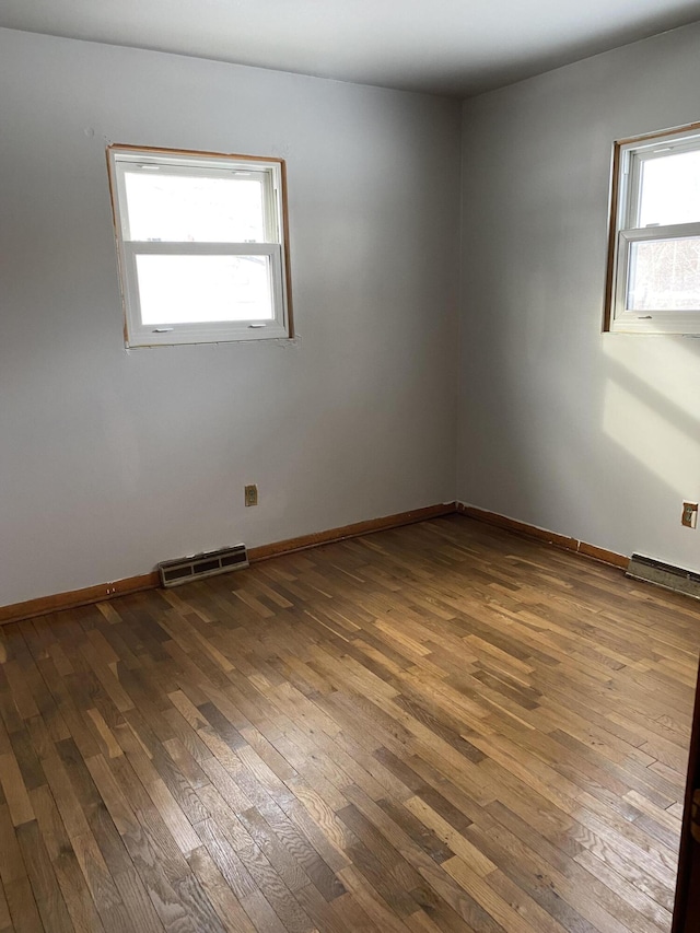 empty room featuring wood-type flooring