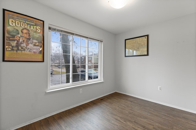 empty room featuring dark hardwood / wood-style floors