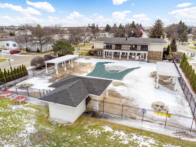 rear view of property featuring a patio and a balcony