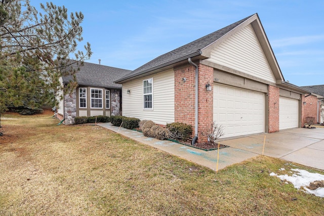 view of front of house with a garage and a front lawn