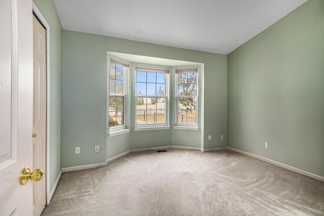 empty room with light colored carpet