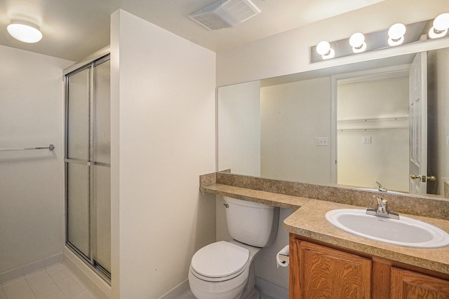 bathroom with vanity, toilet, and an enclosed shower