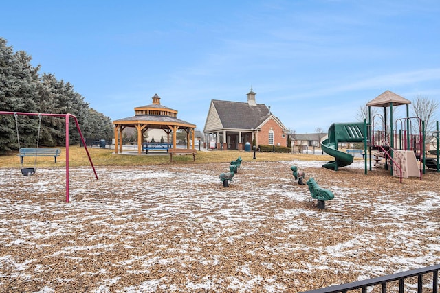 snow covered playground featuring a gazebo