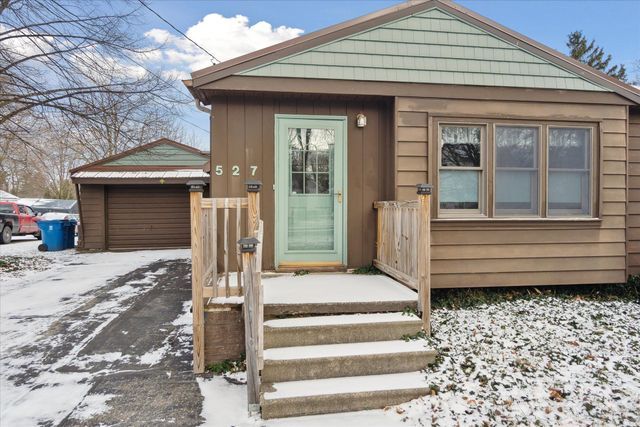 view of front of house featuring an outbuilding