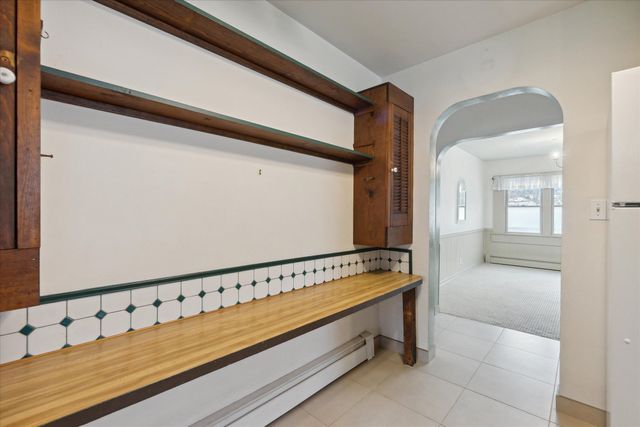 hallway featuring light tile patterned floors