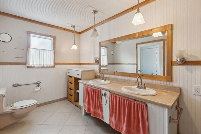 bathroom with vanity, tile patterned floors, and toilet