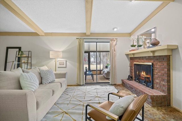 carpeted living room featuring beam ceiling, a fireplace, and a textured ceiling