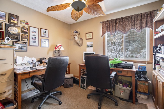 office area with ceiling fan and carpet