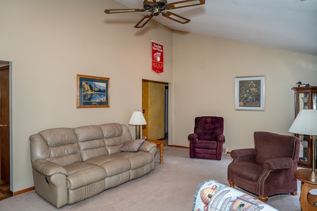 carpeted living room featuring ceiling fan and vaulted ceiling