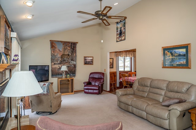 carpeted living room featuring high vaulted ceiling and ceiling fan