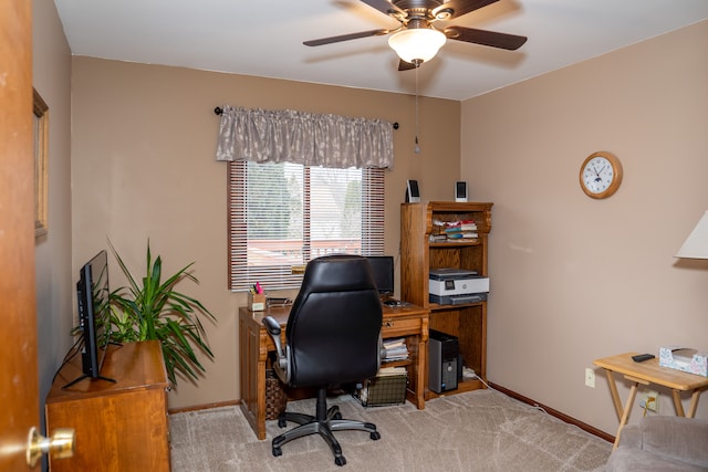 home office with ceiling fan and light colored carpet