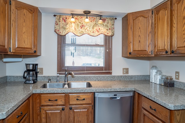 kitchen with dishwasher, sink, and hanging light fixtures