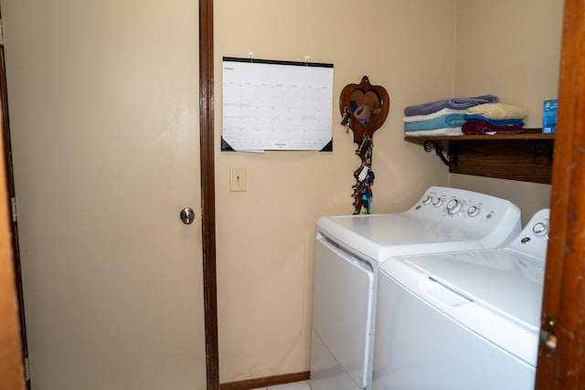 laundry area featuring washing machine and clothes dryer